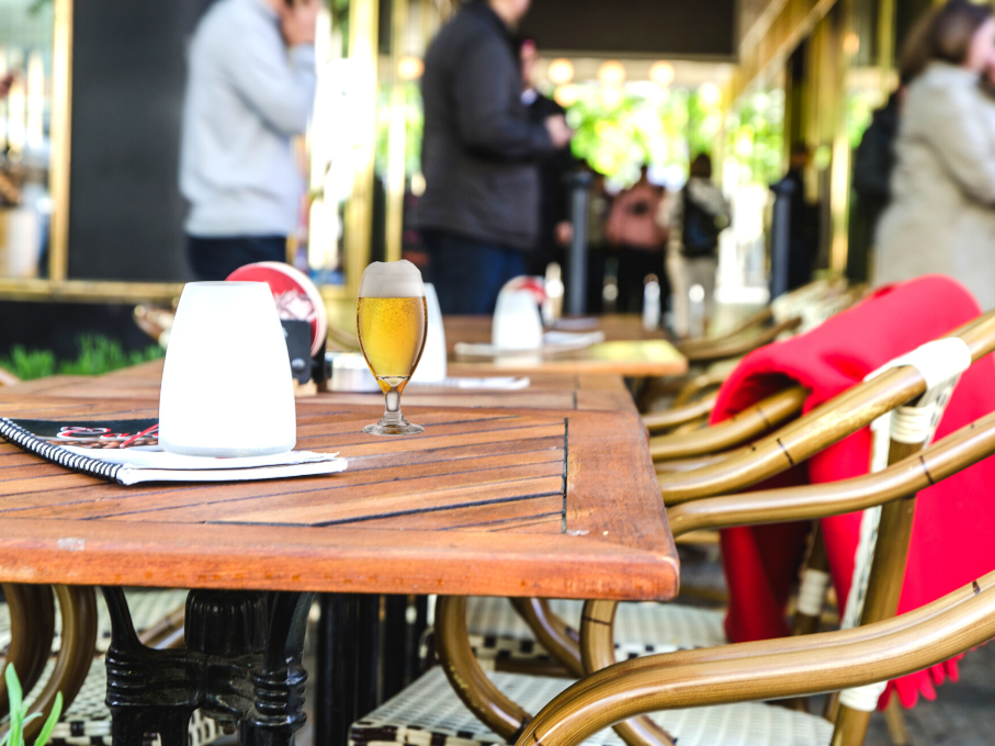 Restaurant table on patio with beer