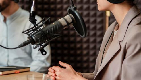 Podcast microphone with person in studio