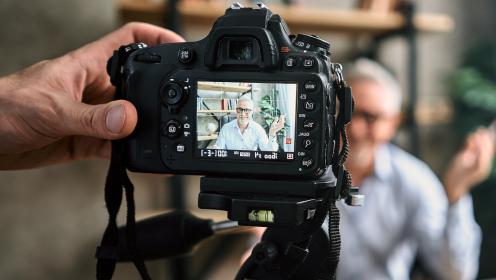 DSLR camera recording man