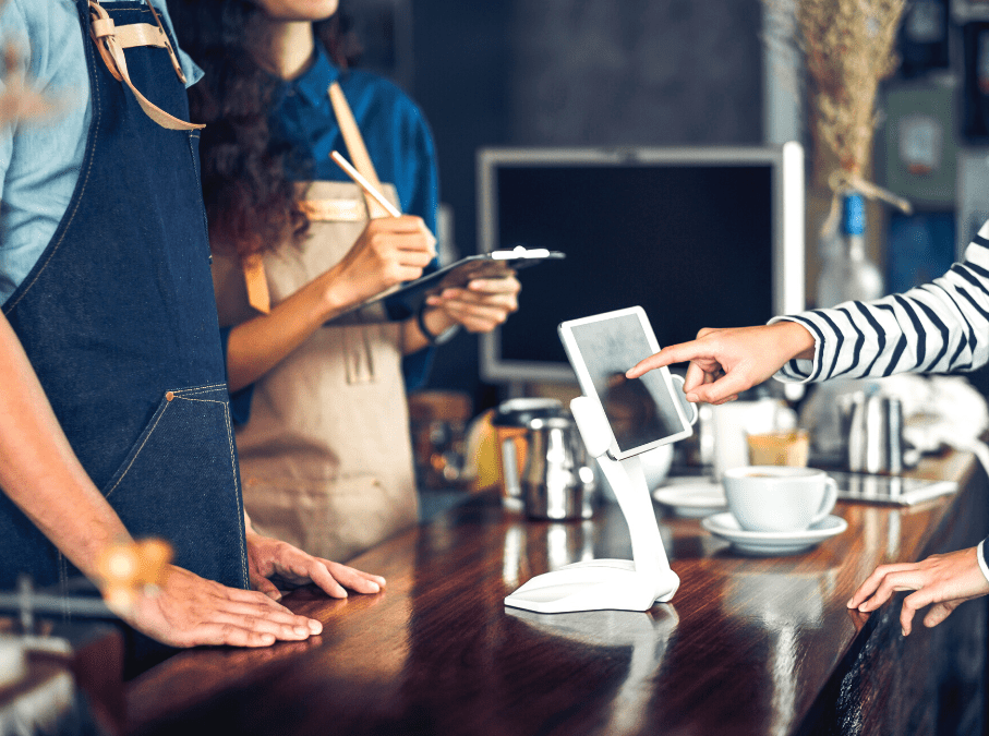 Restaurant employee putting bill in POS
