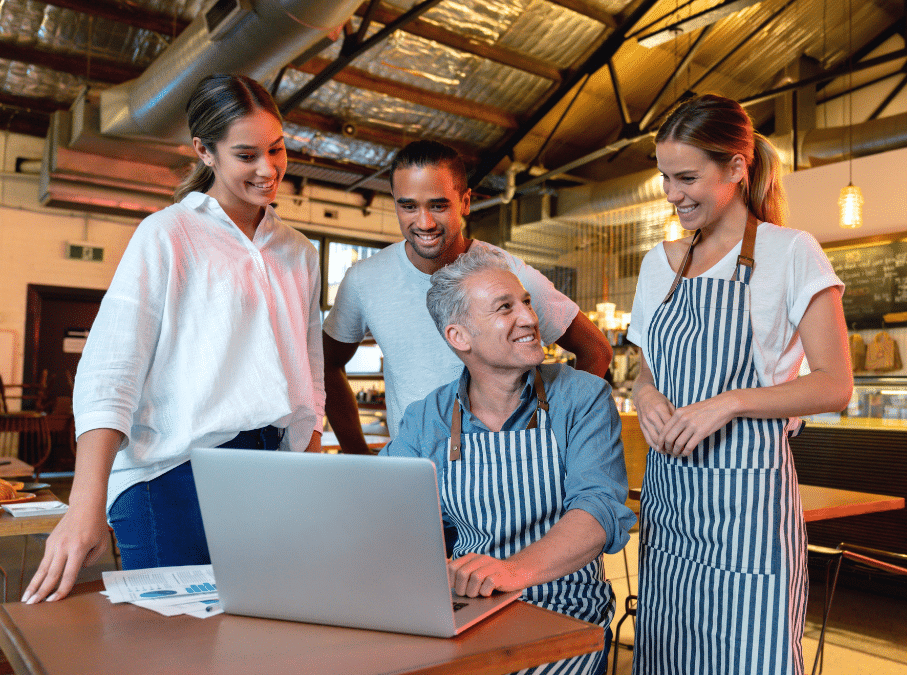 Group of restaurant employees learning accounting