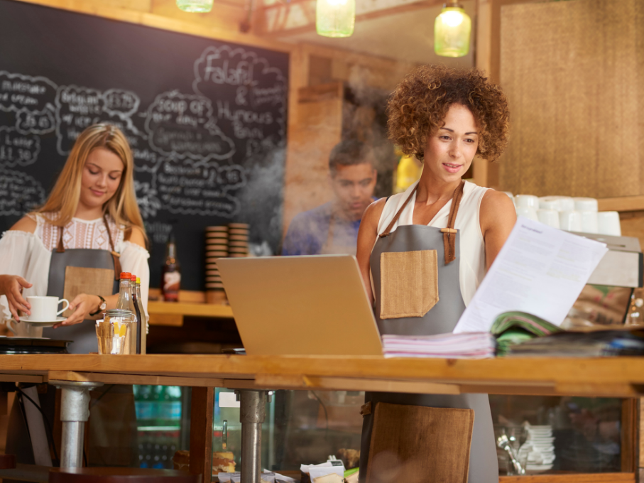 Woman reviewing restaurant accounting documents