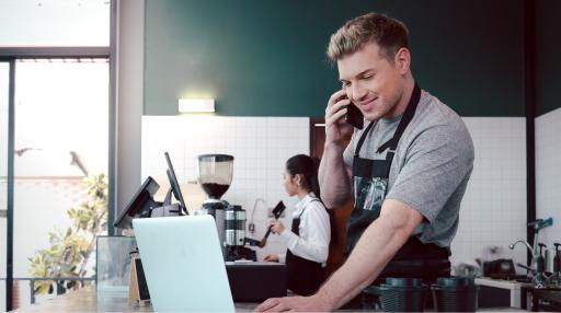 Restaurant employee on the phone taking order