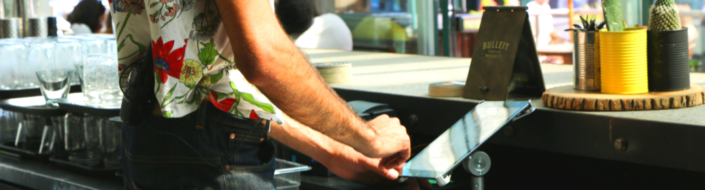 Restaurant employee at POS system