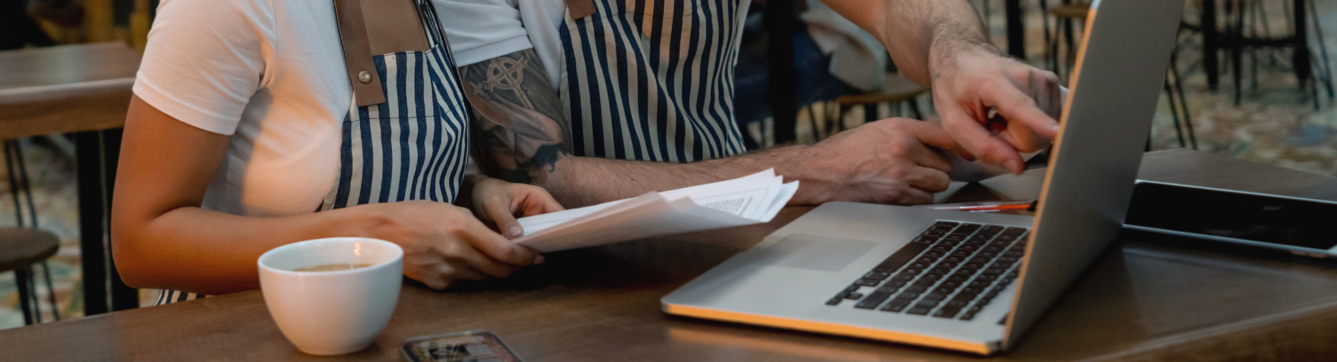 Restaurant operators reviewing financial statements