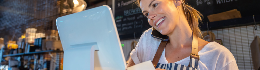 Woman on phone at restaurant