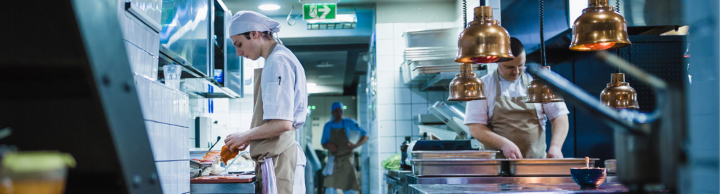 Restaurant BOH employees prepping in the kitchen
