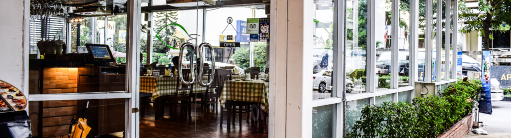 Exterior of a restaurant cafe in the day time.