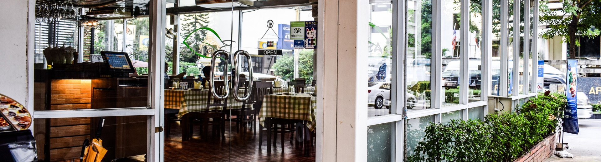 Exterior of a restaurant cafe in the day time.