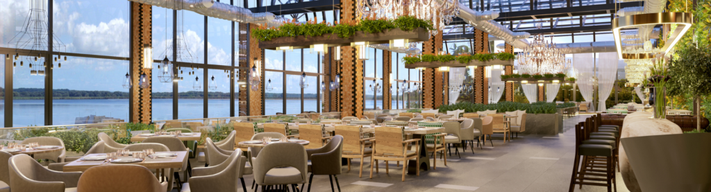 Empty elegant restaurant dining room overlooking water.